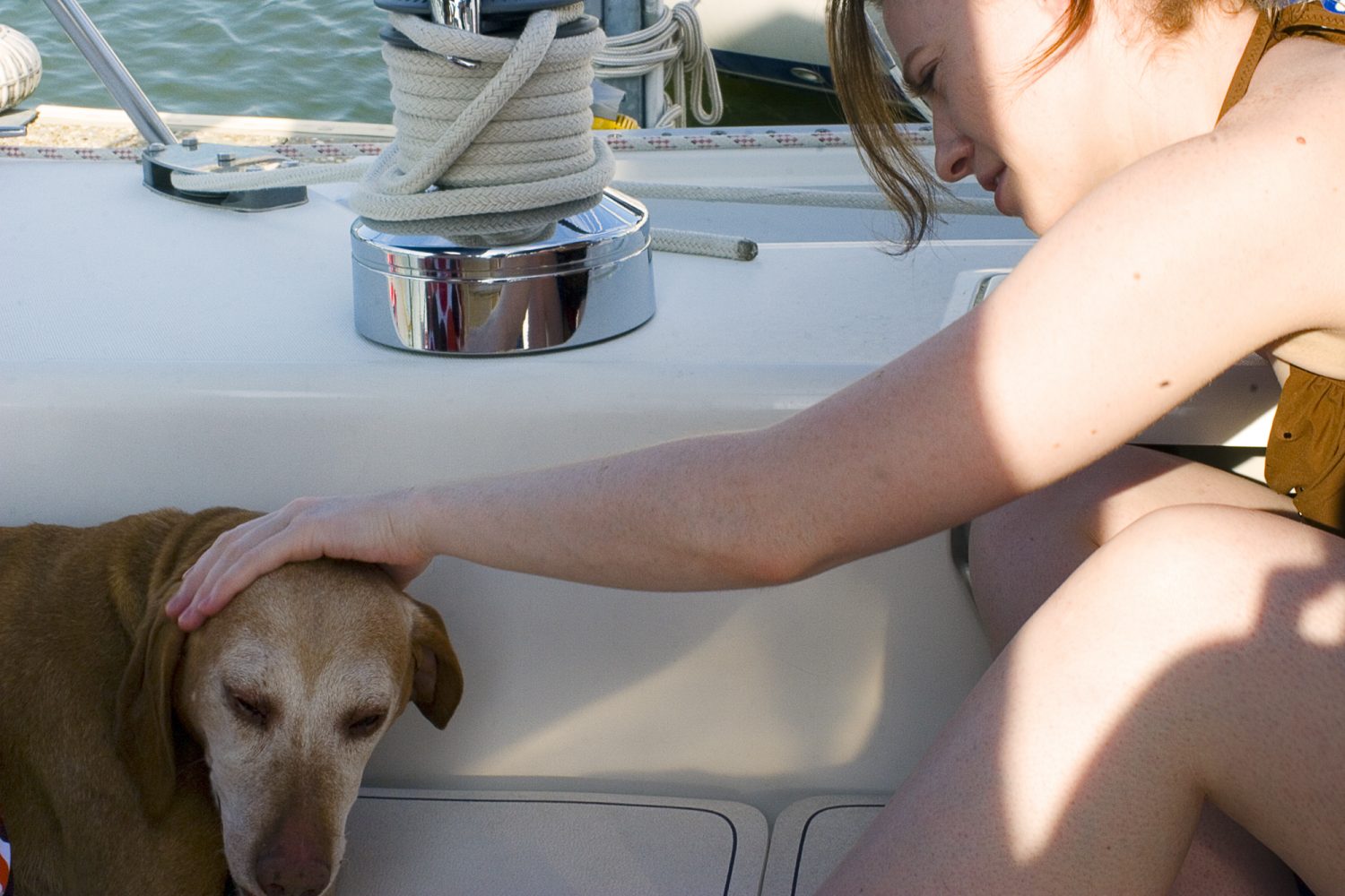 Mary with my dog Nikki on a sail boat